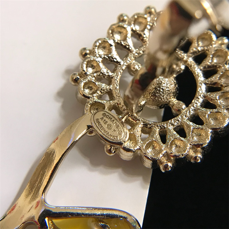 Ch**el sunflower flower pendant oil drop ear clip