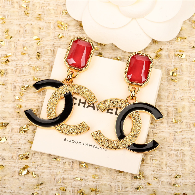 Ch**el enamel and gold relief earrings