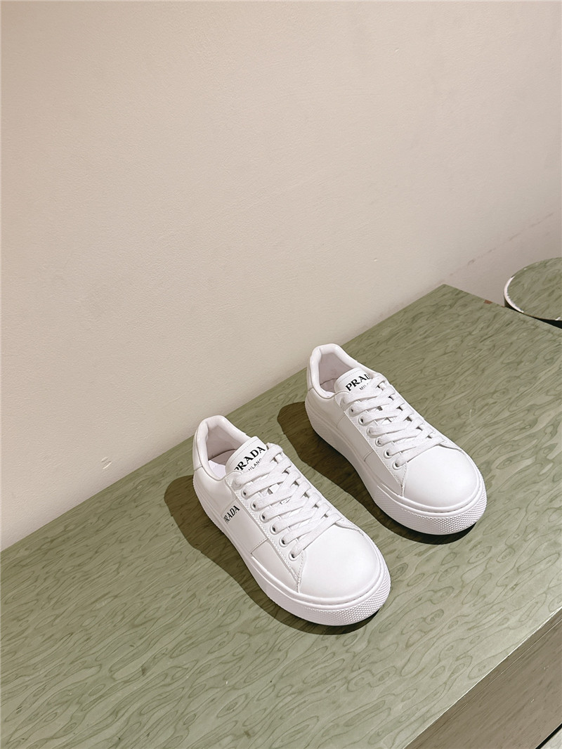 Pra*a white laced low-top sneakers