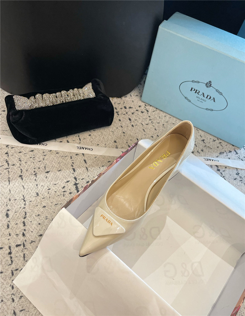 Pra*a triangle logo ivory brushed leather pumps