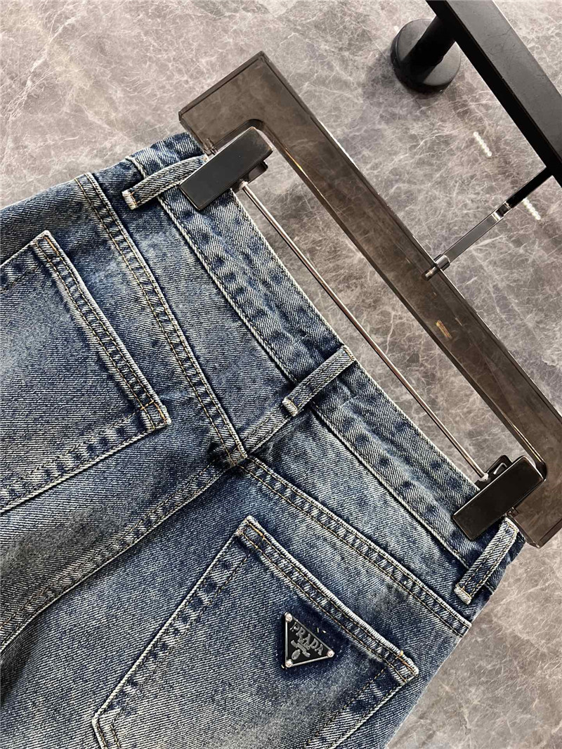 Pra*a triangle logo denim trousers
