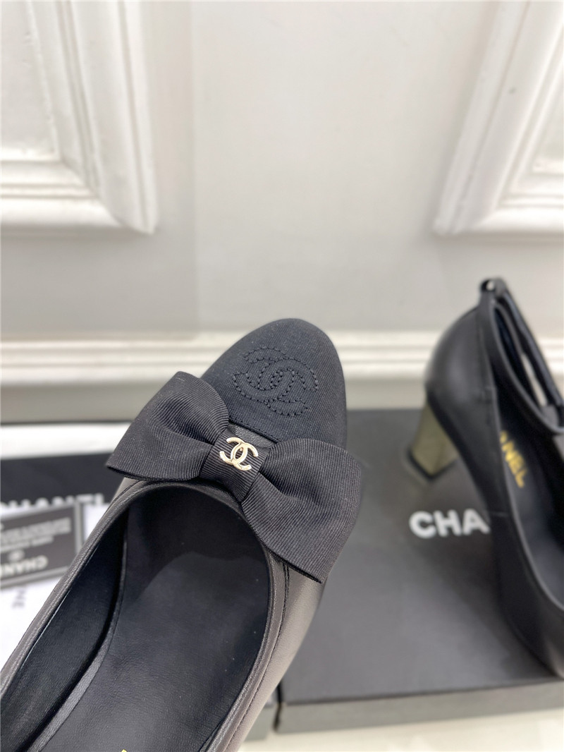 Ch**el bow mary jane heel pumps in black calfskin