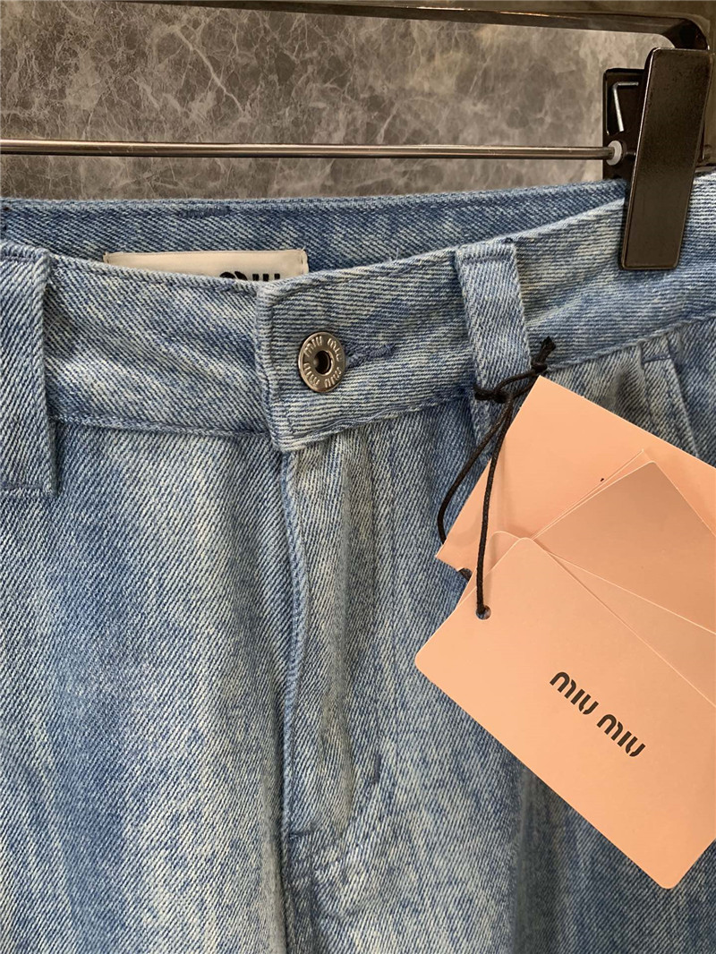 M1um1u striped tie-dye denim trousers