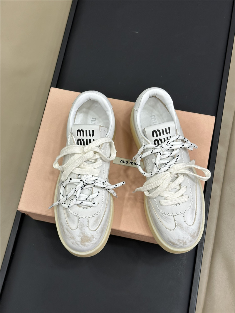 Miu Miu Bleached Leather Low Top Sneakers