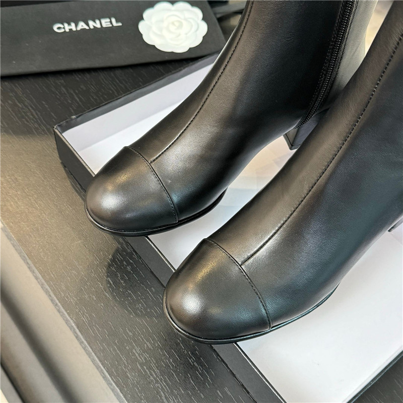 Ch**el black calfskin cap toe ankle boots
