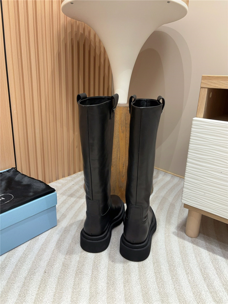 Pra*a women logo plaque leather boots in black